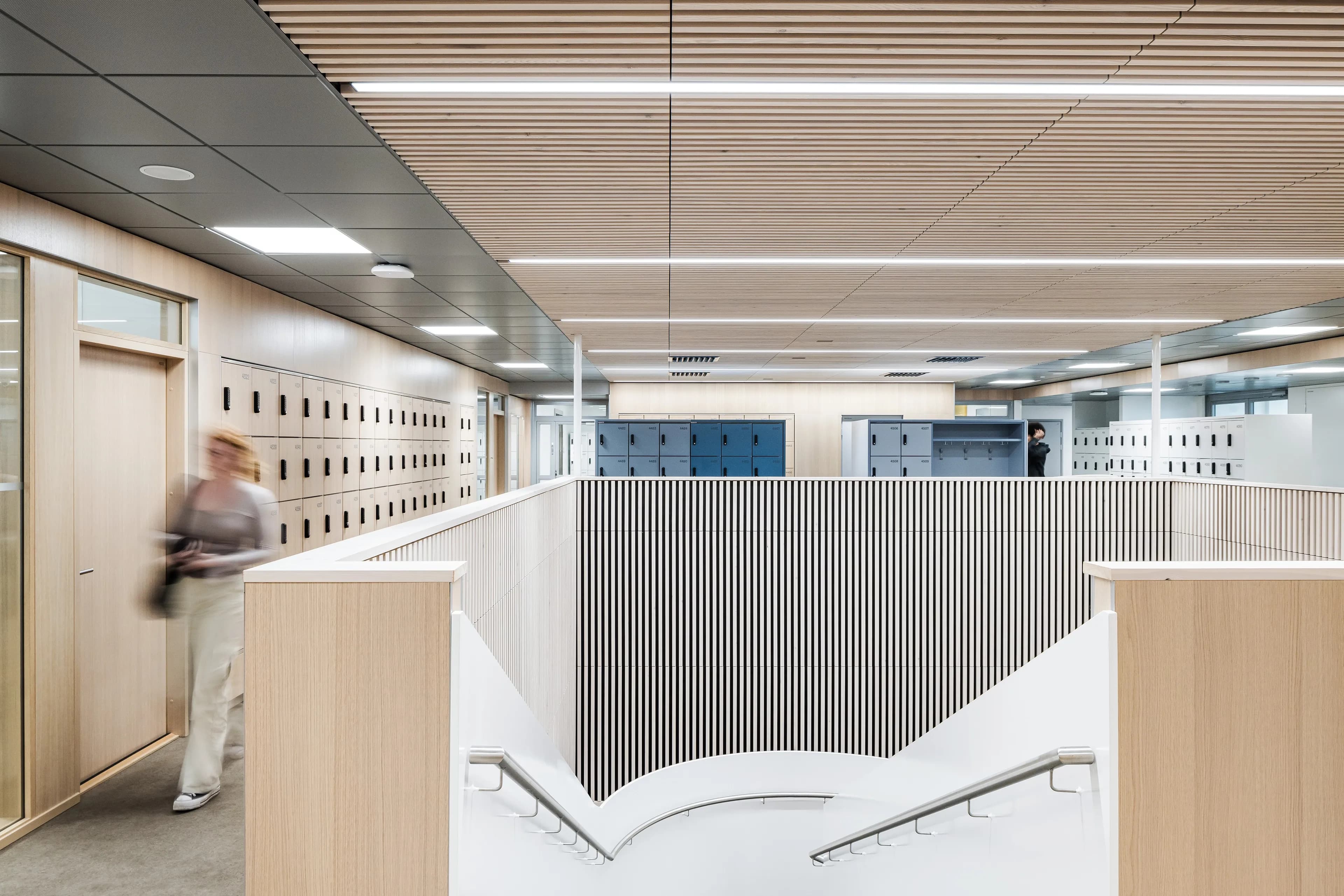 Staircase and student storage areas at Helsinki Upper-Secondary School of Languages.