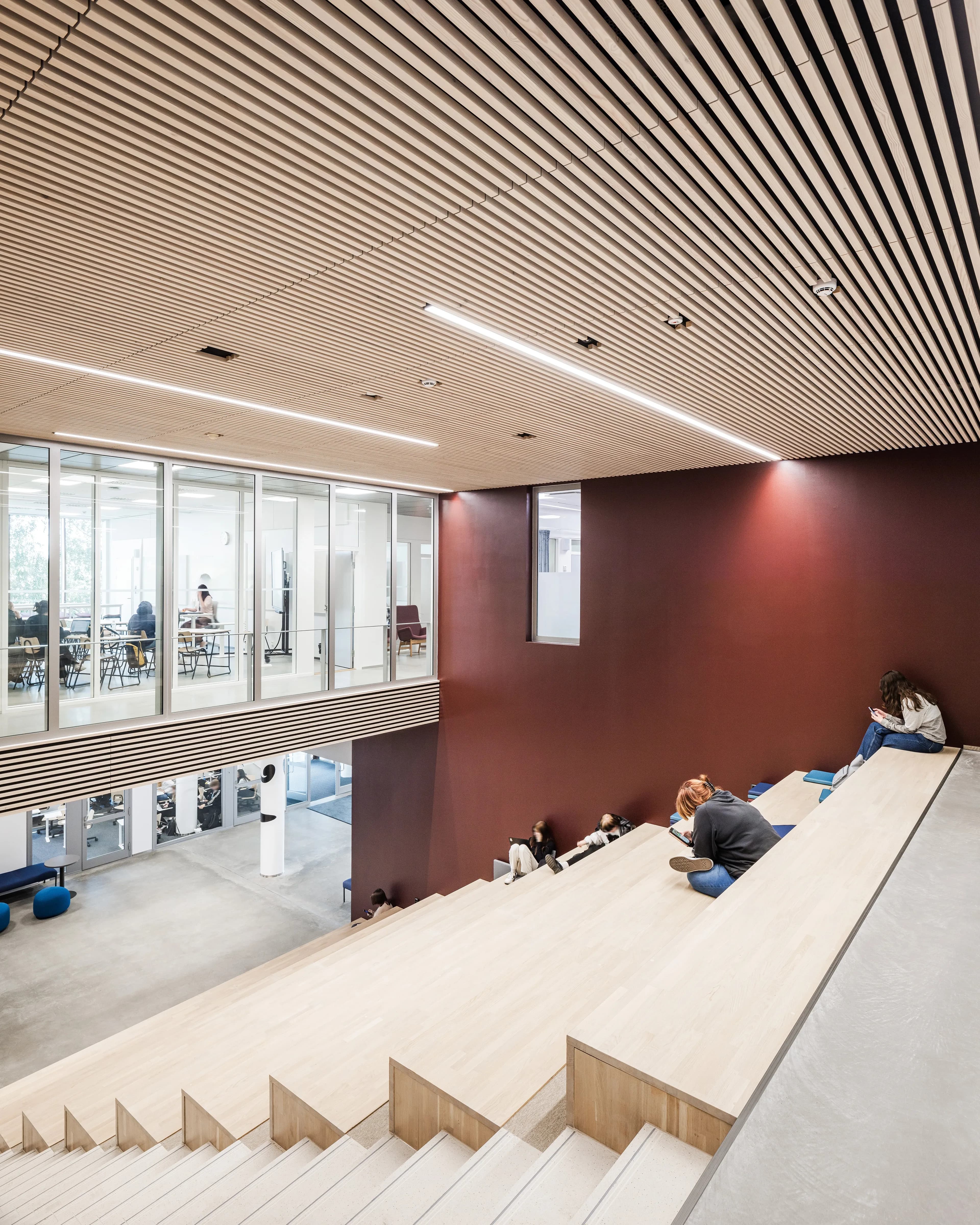 Stairs with integrated seating solutions at Helsinki Upper-Secondary School of Languages.