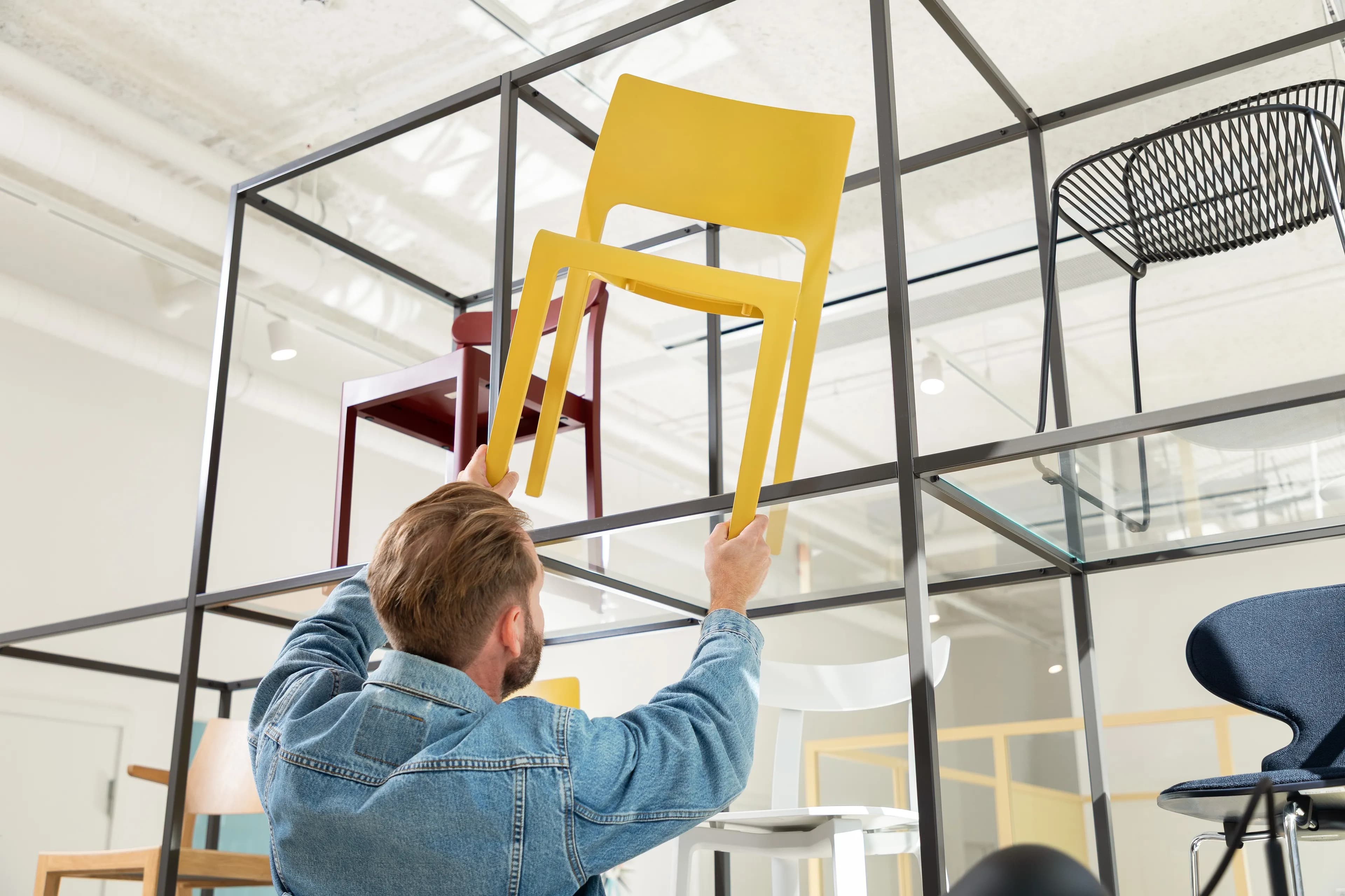 Image of a person lifting a chair.