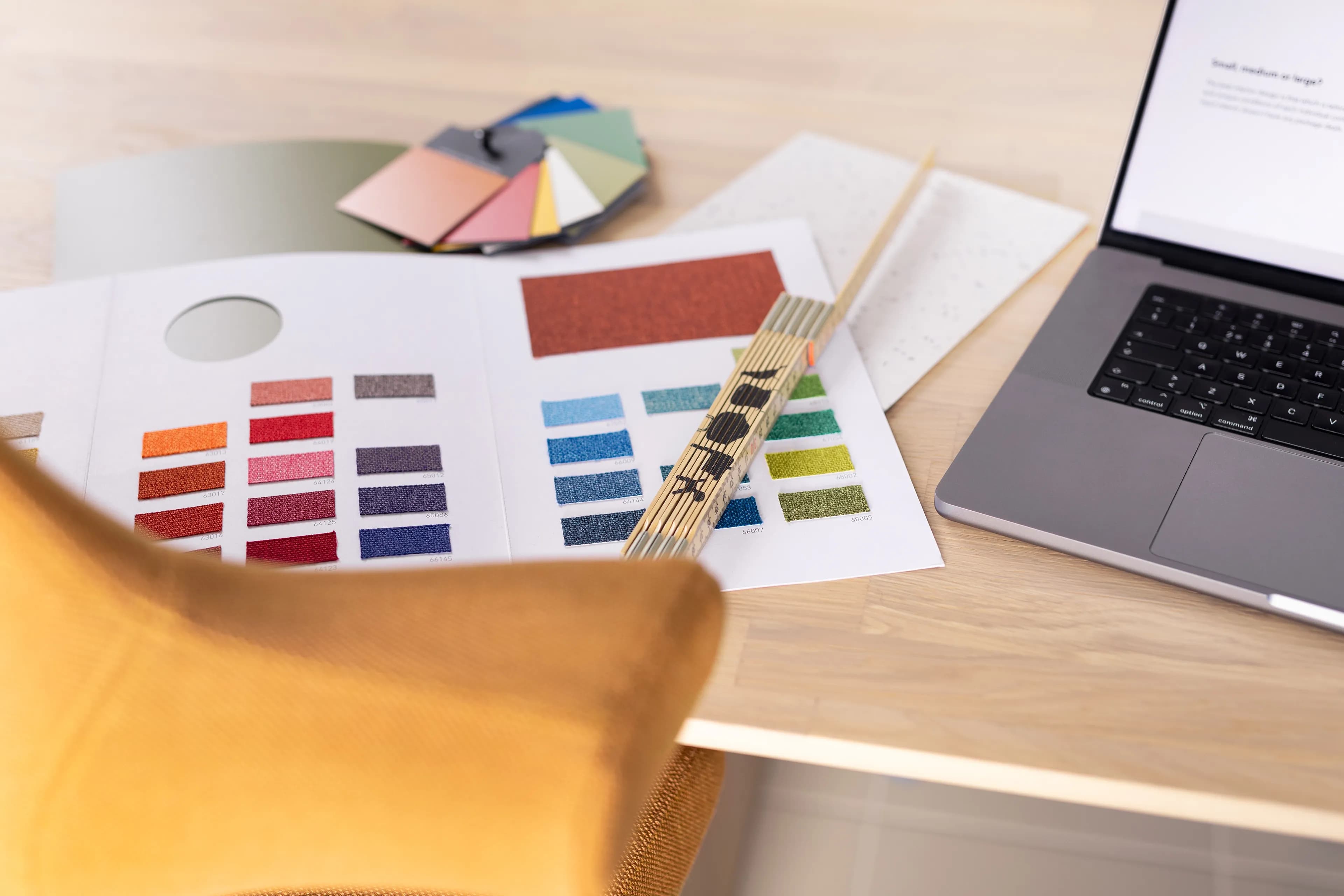 Image of a desk with fabric and material samples.